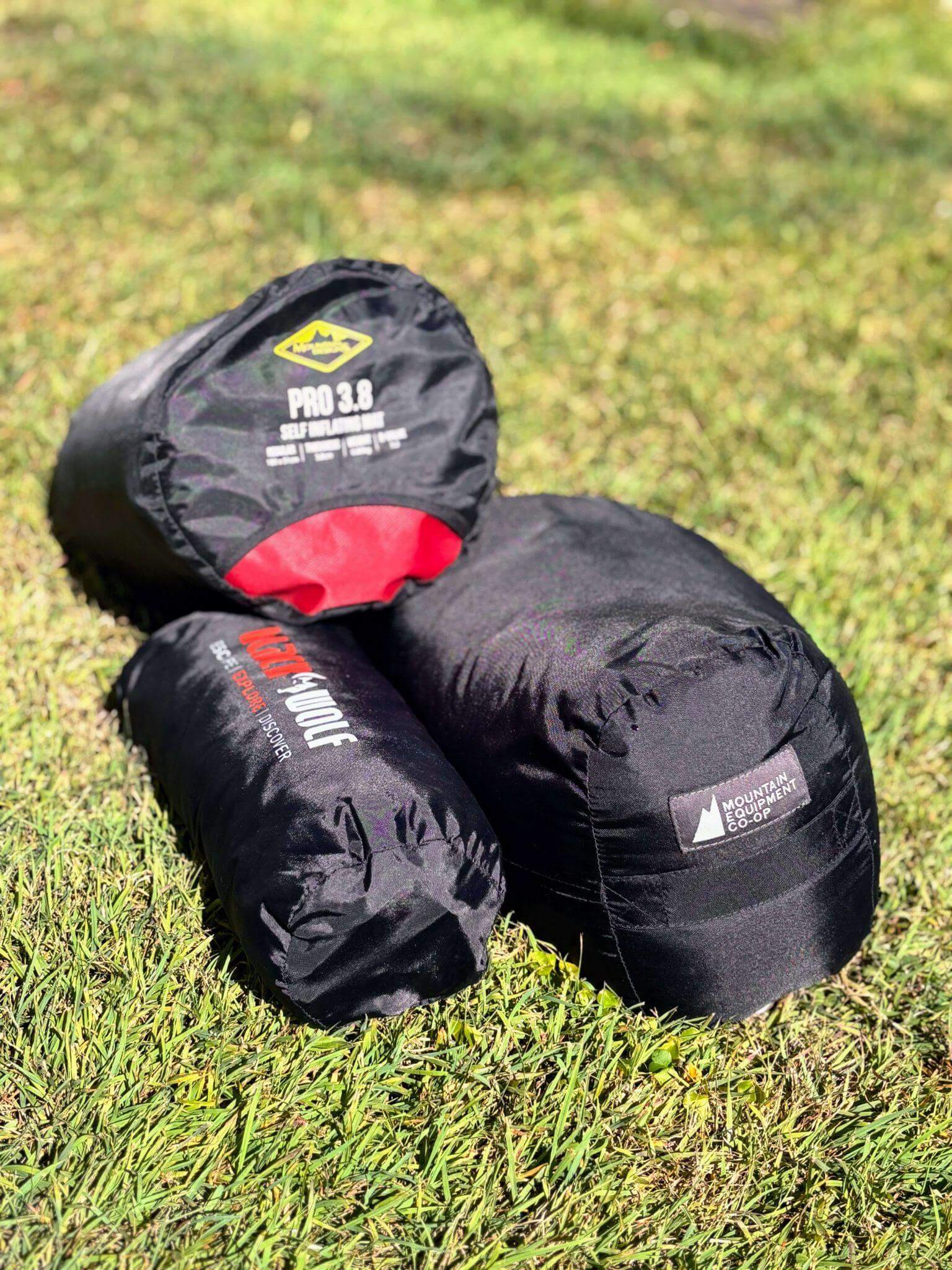 Compact sleeping bags and inflatable pillow packed for hut to hut hiking comfort and warmth