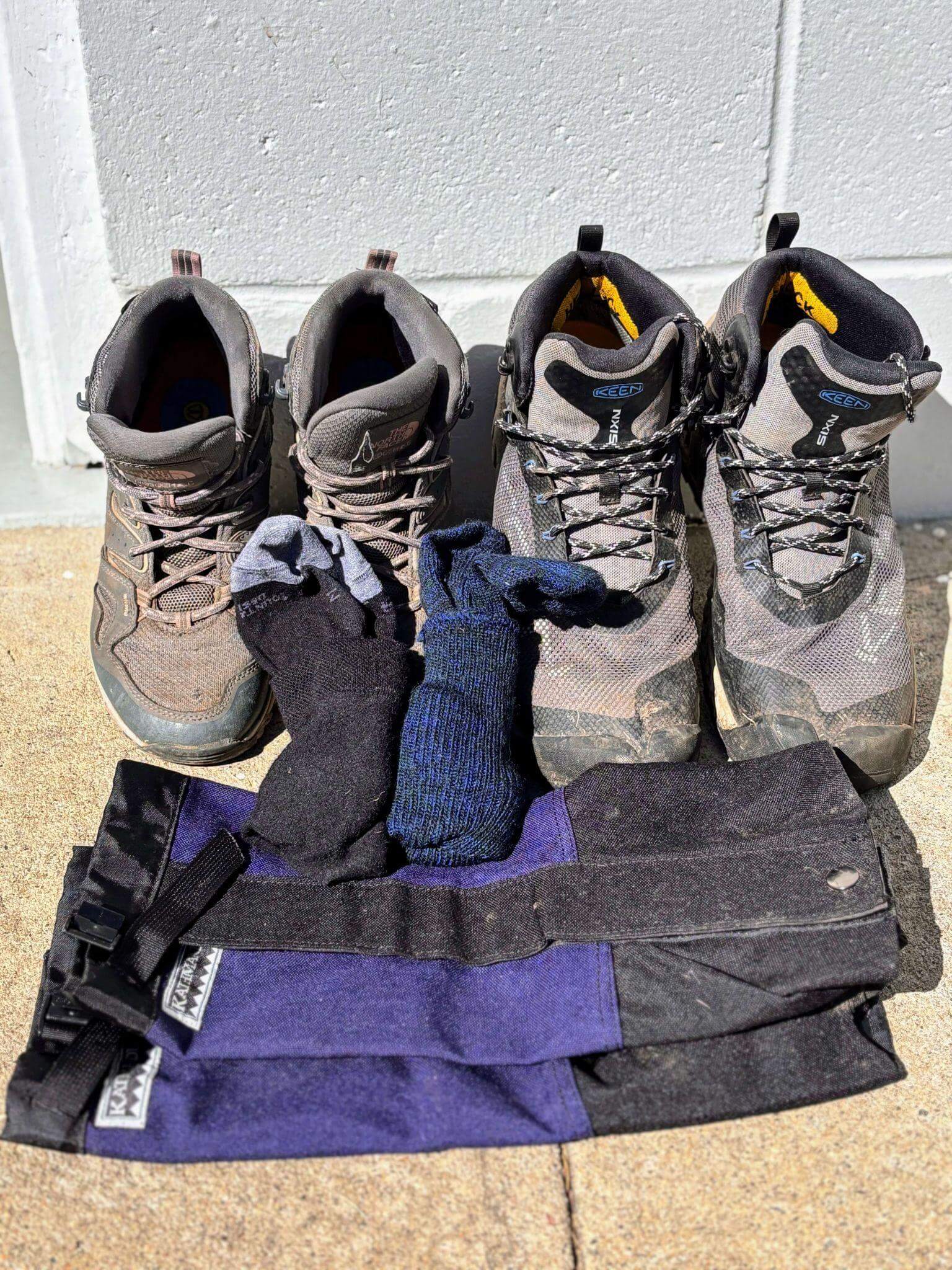 Keen waterproof hiking boots with liner socks and wool hiking socks demonstrating proper footwear for hut to hut hiking